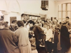 1960 Library patrons check out items for the S.O.S. program