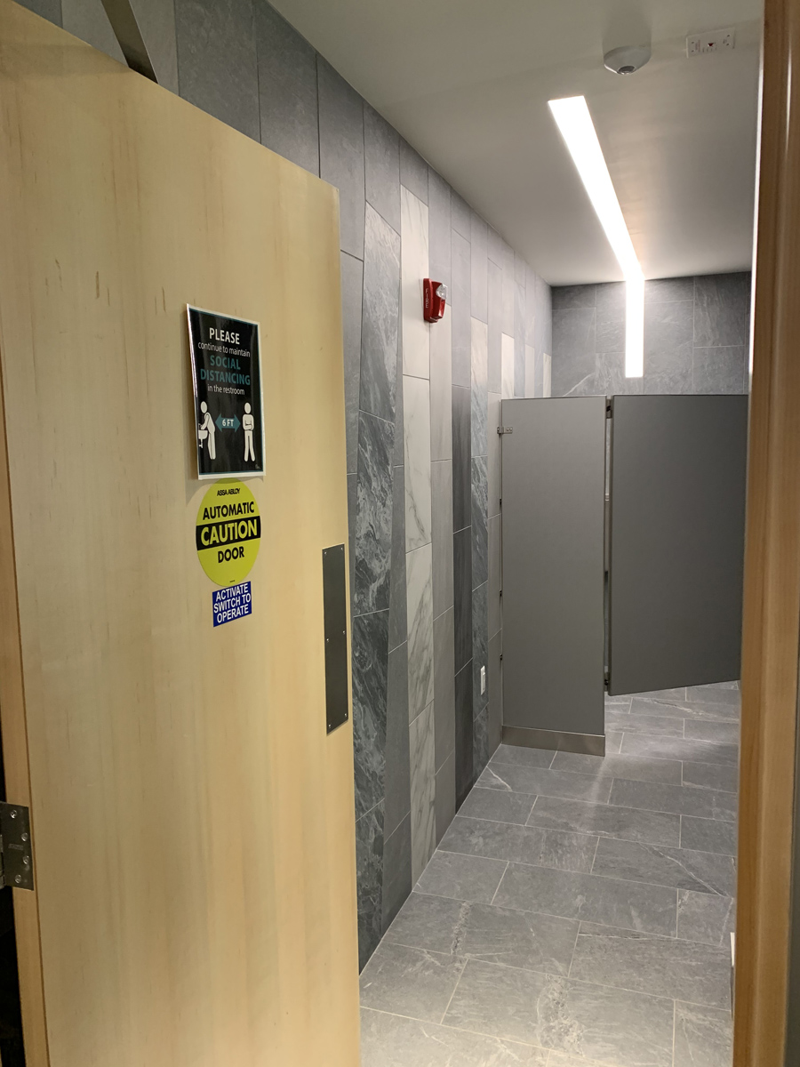The women’s restroom now has three stalls. The men’s restroom now has one stall and two urinals.