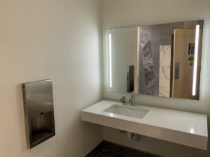 The restroom sinks have automatic faucets and automatic soap dispensers.