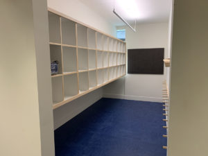 The entry hallway includes a coat and stroller room.