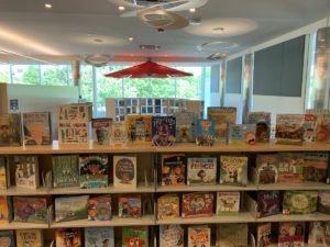 The room is filled with many shelves to display new books. Youth librarians have been busy purchasing new books for the collection.