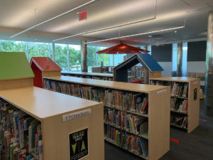 The picture book shelving includes three reading cubbies that children and adults enjoy using for reading.
