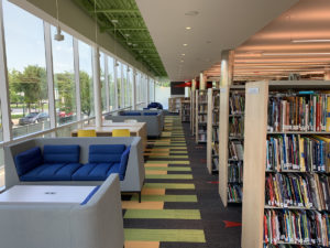 The perimeter of the room includes many study tables and lounge seating options. Due to COVID-19, we have had to place most of the furniture into temporary storage.