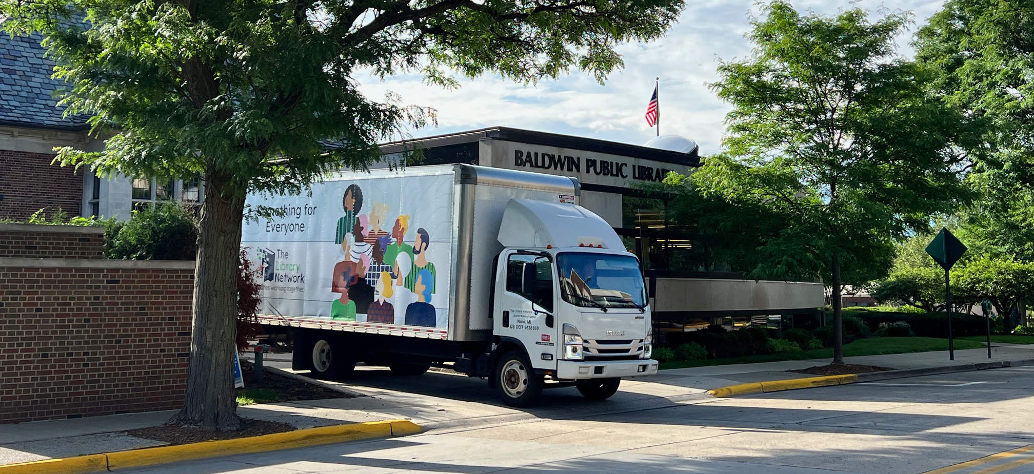 MeLcat delivery truck outside of Baldwin Public Library