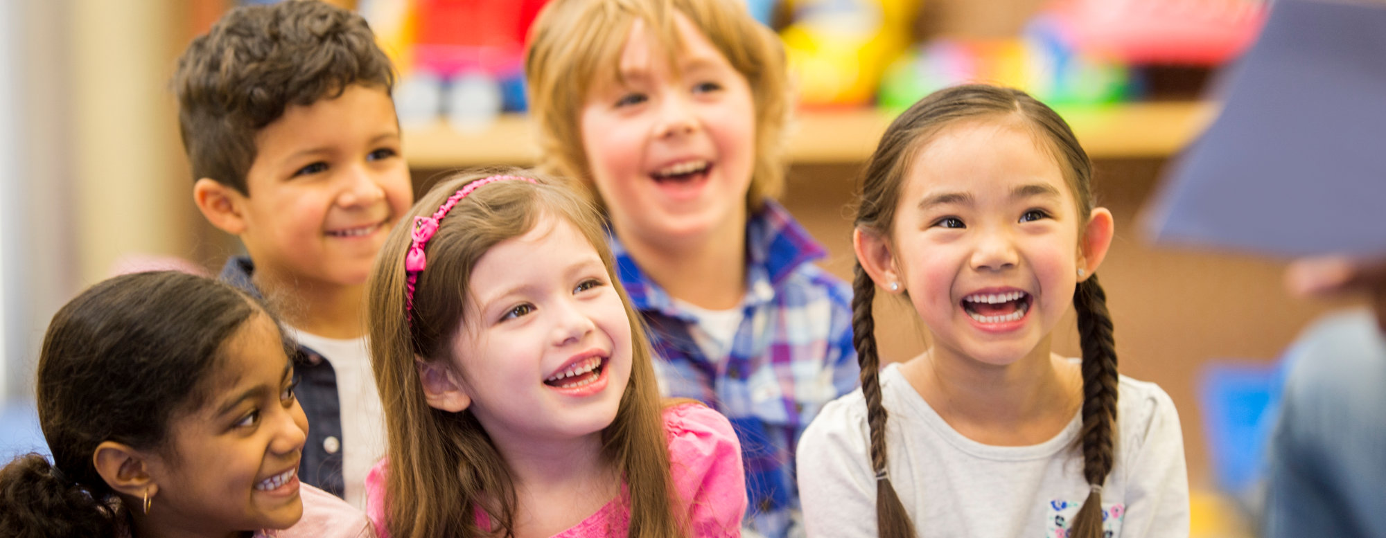 A group of children smiling.
