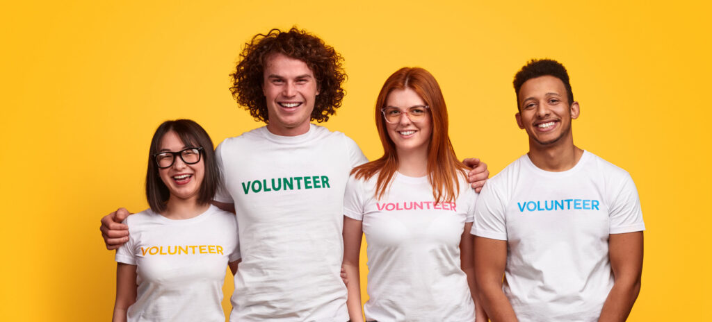 4 people in volunteer t-shirts