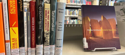Women in Architecture books on a metal shelf