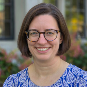 Rebekah Craft headshot standing outside library