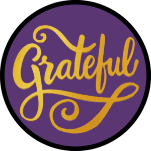 script text of the word grateful in gold on purple background